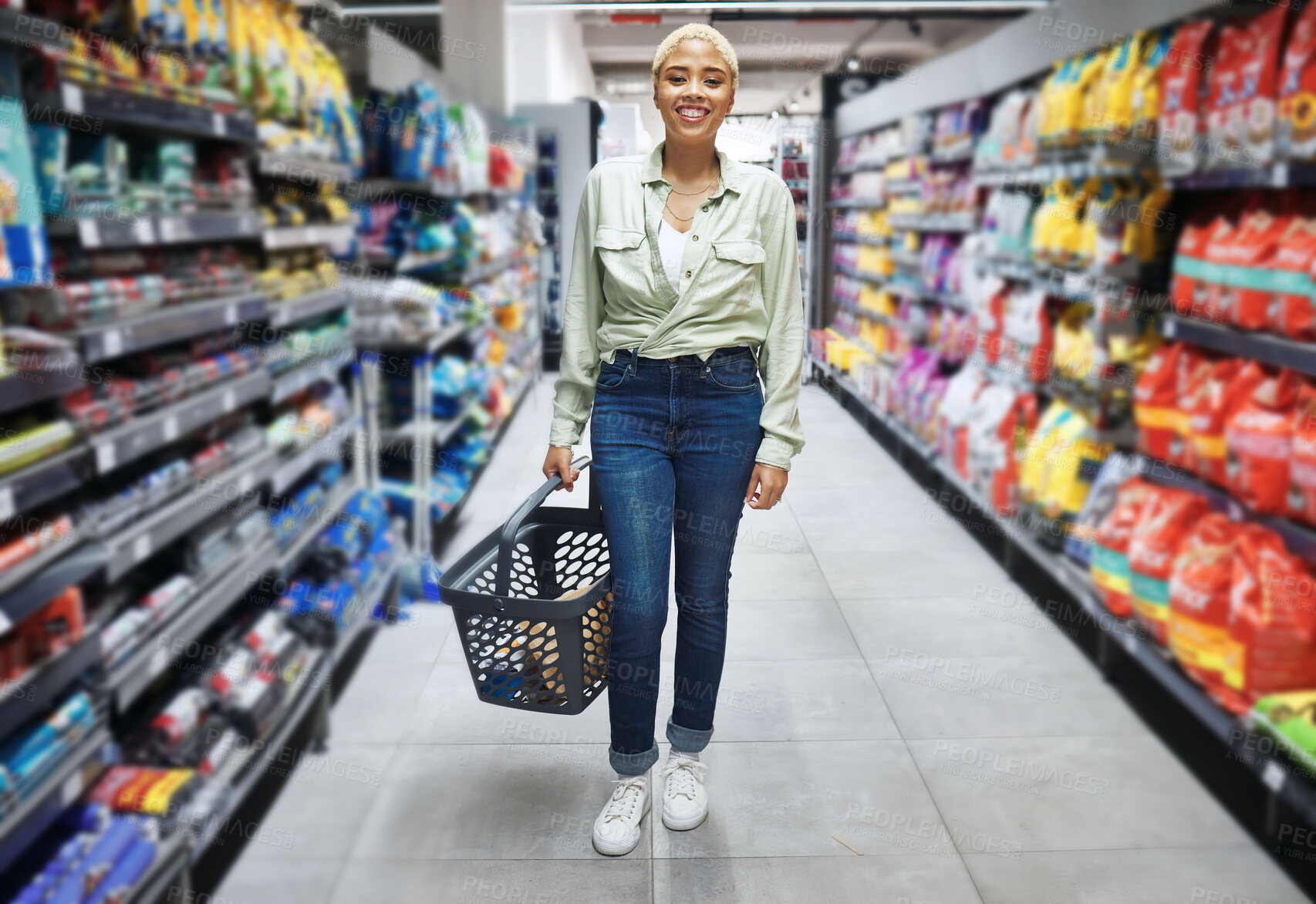 Buy stock photo Portrait, basket and happy woman grocery shopping in retail, supermarket and convenience store for food. Groceries, market and African customer smile in shop for wholesale, sales deal and discount.