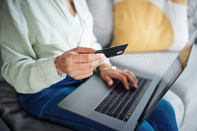 Buy stock photo Hands, laptop and credit card for home online shopping, fintech payment and e commerce on sofa. Closeup of person typing on computer for internet banking, website subscription or application for loan