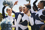 Cheerleaders, outdoor and champion with celebration, smile and winner with happiness, excited and teamwork. Women, men and group cheering, grass field or chanting with workout, support and motivation