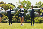 Portrait, motion blur and a cheerleader group of young people outdoor for a training routine or sports event. Support, team and diversity with a happy cheer squad on a field together for motivation