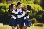 Teamwork, hug or happy cheerleader with women outdoor in training or sports event together. Celebrate, smile or proud girl by an excited cheer squad group on field for support, winning or fitness 