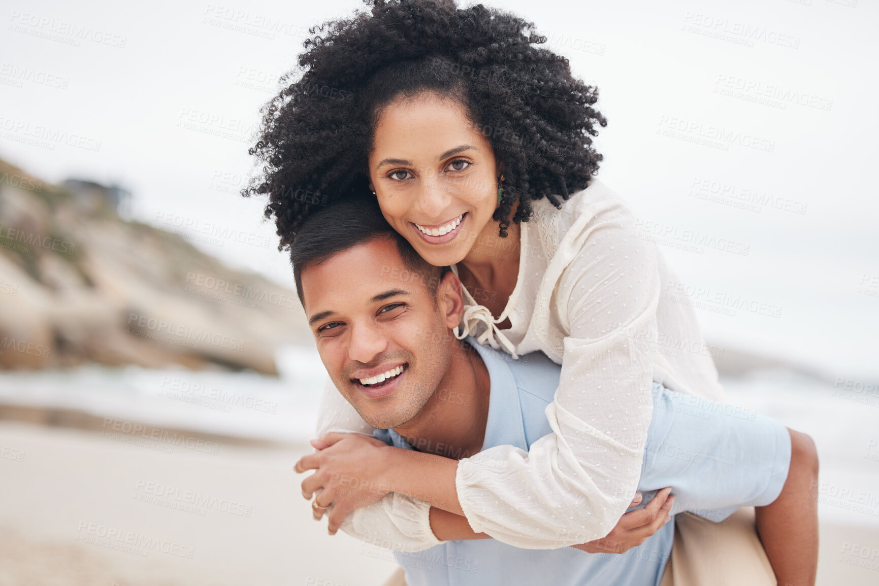 Buy stock photo Portrait, piggyback and happy couple at the beach with love, bond and fun in nature together. Freedom, travel and face of excited people at sea with carrying, games or freedom celebration in Bali