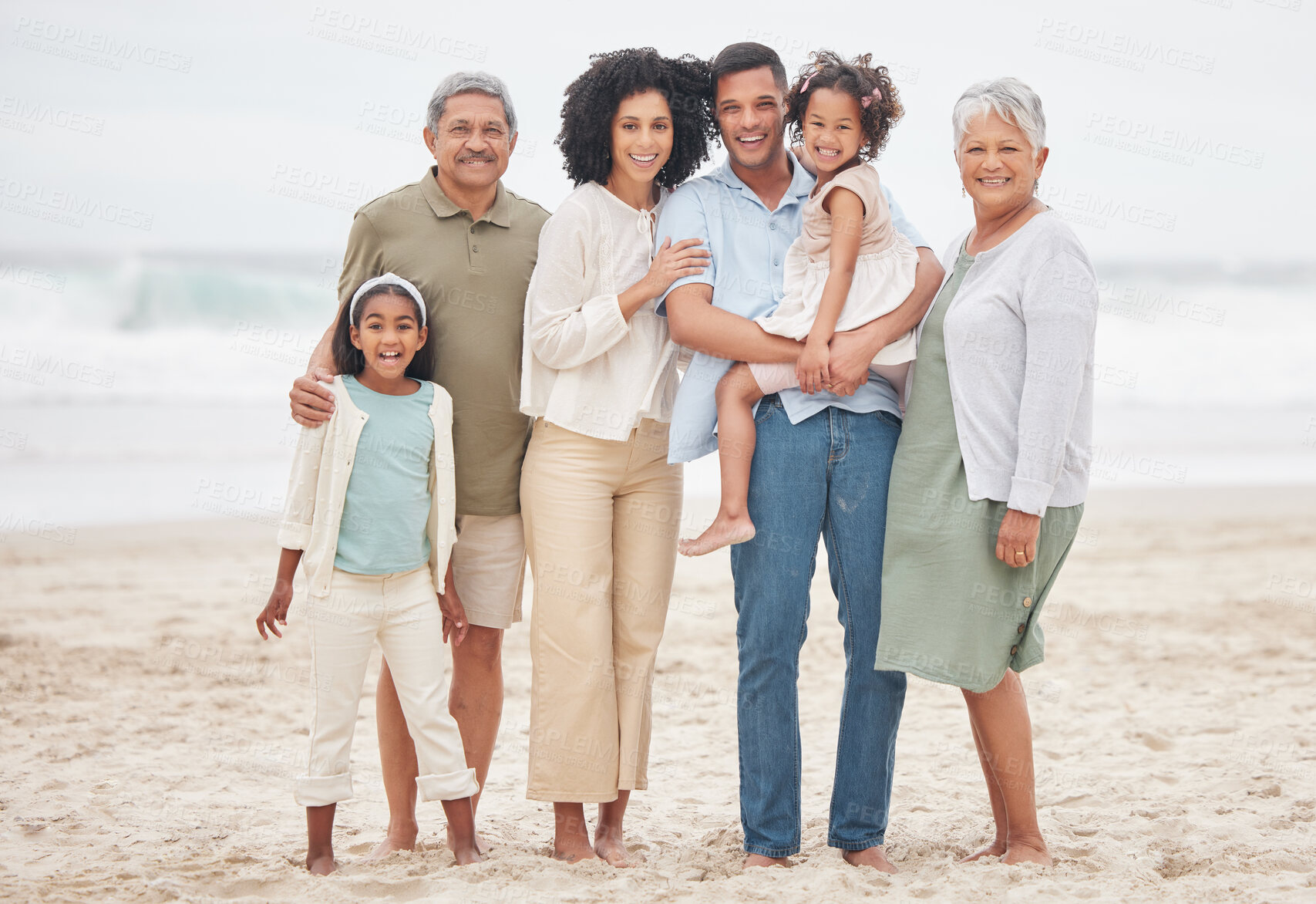 Buy stock photo Portrait, smile and big family at beach on vacation, holiday or travel outdoor in summer. Happy parents, grandparents and kids at ocean for care, children bonding and love connection together at sea