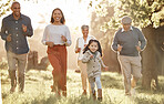 Family, running and parents or grandparents with girl child in park for freedom, adventure or playing in summer. Love, men or women with fun on grass field or forest in sunshine for care or happiness