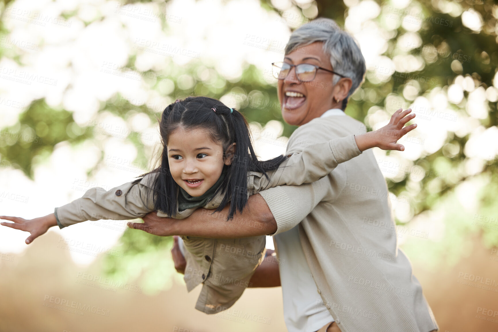 Buy stock photo Family, girl child or grandmother with fly or airplane for fantasy play, fun game or together with bokeh in nature. People, kid or grandma outdoor with happiness for love, care and bonding or excited