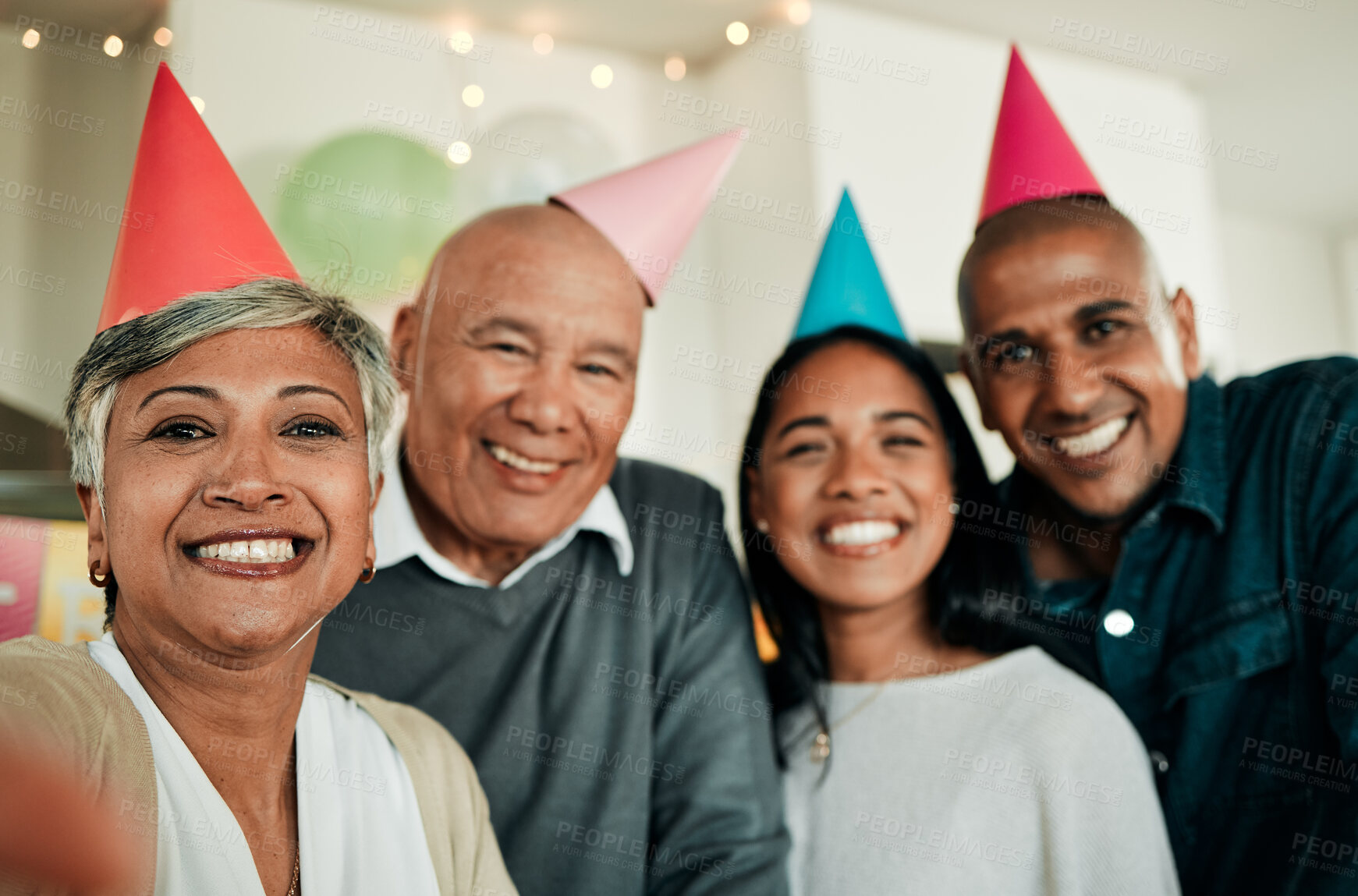 Buy stock photo Selfie, home and family with birthday party, love and celebration with happiness, weekend break and bonding. Portrait, old man and elderly woman with people, hats and group with a smile and cheerful