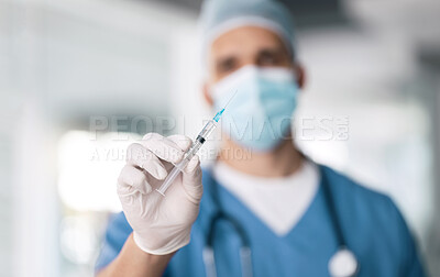 Buy stock photo Man, doctor and hand with needle for vaccine, injection or antibiotic for healthcare or medical cure at hospital. Closeup of male person, nurse or surgeon with mask, gloves and flu shot at clinic