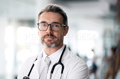 Buy stock photo Serious doctor, portrait and man with glasses in hospital for health, wellness or career in medicine. Face, medical professional and confident surgeon, expert therapist or mature physician in Canada