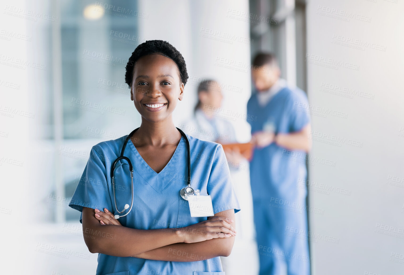 Buy stock photo Happy, nurse and portrait of black woman with arms crossed in hospital for healthcare, wellness and nursing career. Face of African surgeon, confident medical professional worker and employee smile