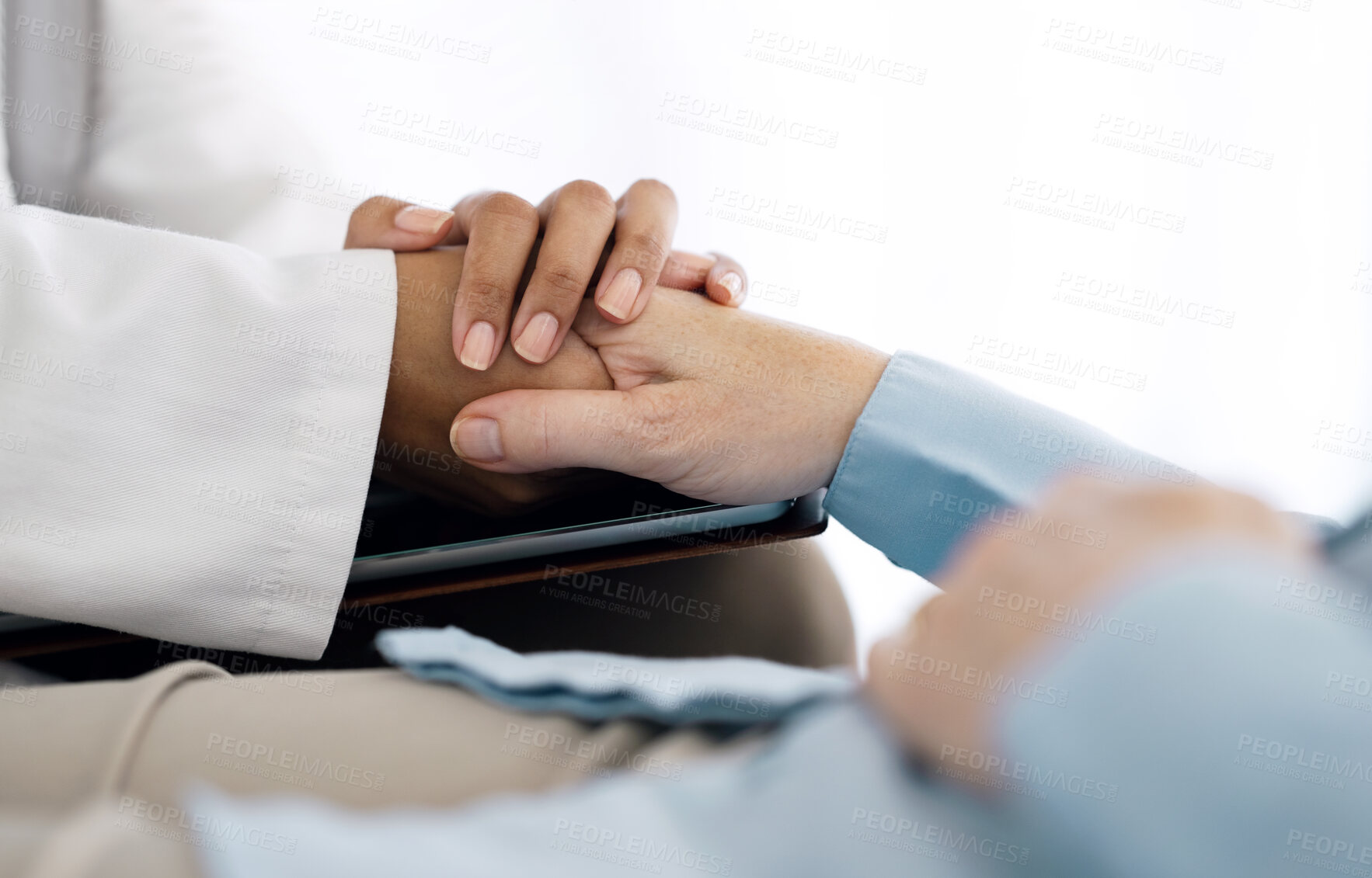 Buy stock photo Hospital, holding hands and doctor with patient for care, comfort and empathy for diagnosis news. Healthcare consulting, clinic and health worker with person for support, wellness and medical results