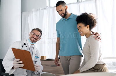 Buy stock photo Doctor consultation clipboard, happy and couple reading gynecology results, news or medical information. Gynecologist review, assessment checklist and patient smile for feedback, notes or health data