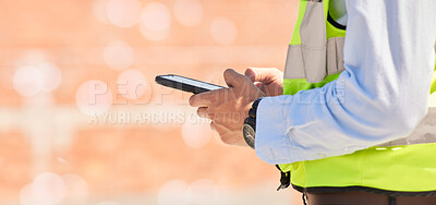 Buy stock photo Hands of engineer on construction site, typing on phone and checking email for building schedule with mockup. Architecture, communication and business man with cellphone reading text, chat or report.