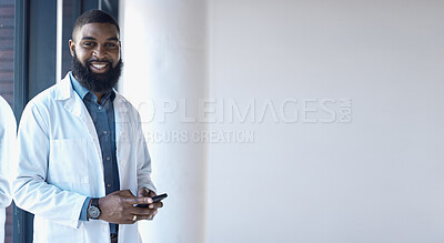 Buy stock photo African doctor, man and portrait with space for mock up, promotion and using phone for networking in clinic. Male medic, smartphone and texting with smile, communication and notification in hospital