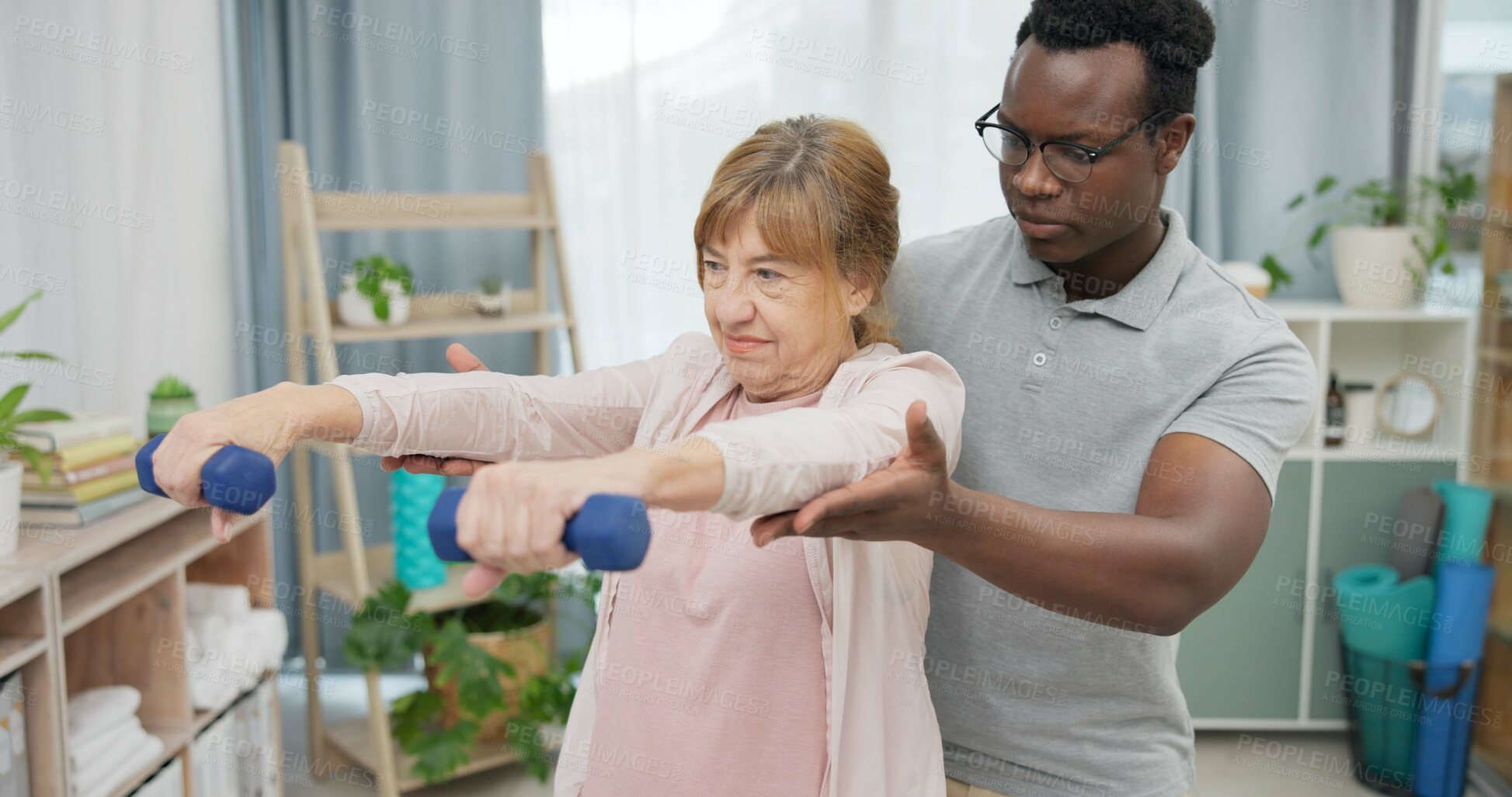 Buy stock photo Physiotherapy, arms and senior woman with black man and dumbbell for body assessment. Physical therapy, weightlifting and elderly female with therapist for recovery, training and healing exercise