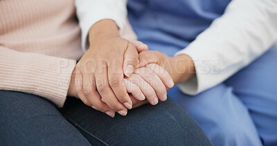Closeup, support and holding hands with nurse with old woman on sofa for empathy, volunteer and trust. Healthcare, retirement and rehabilitation with patient and caregiver in nursing home for healing