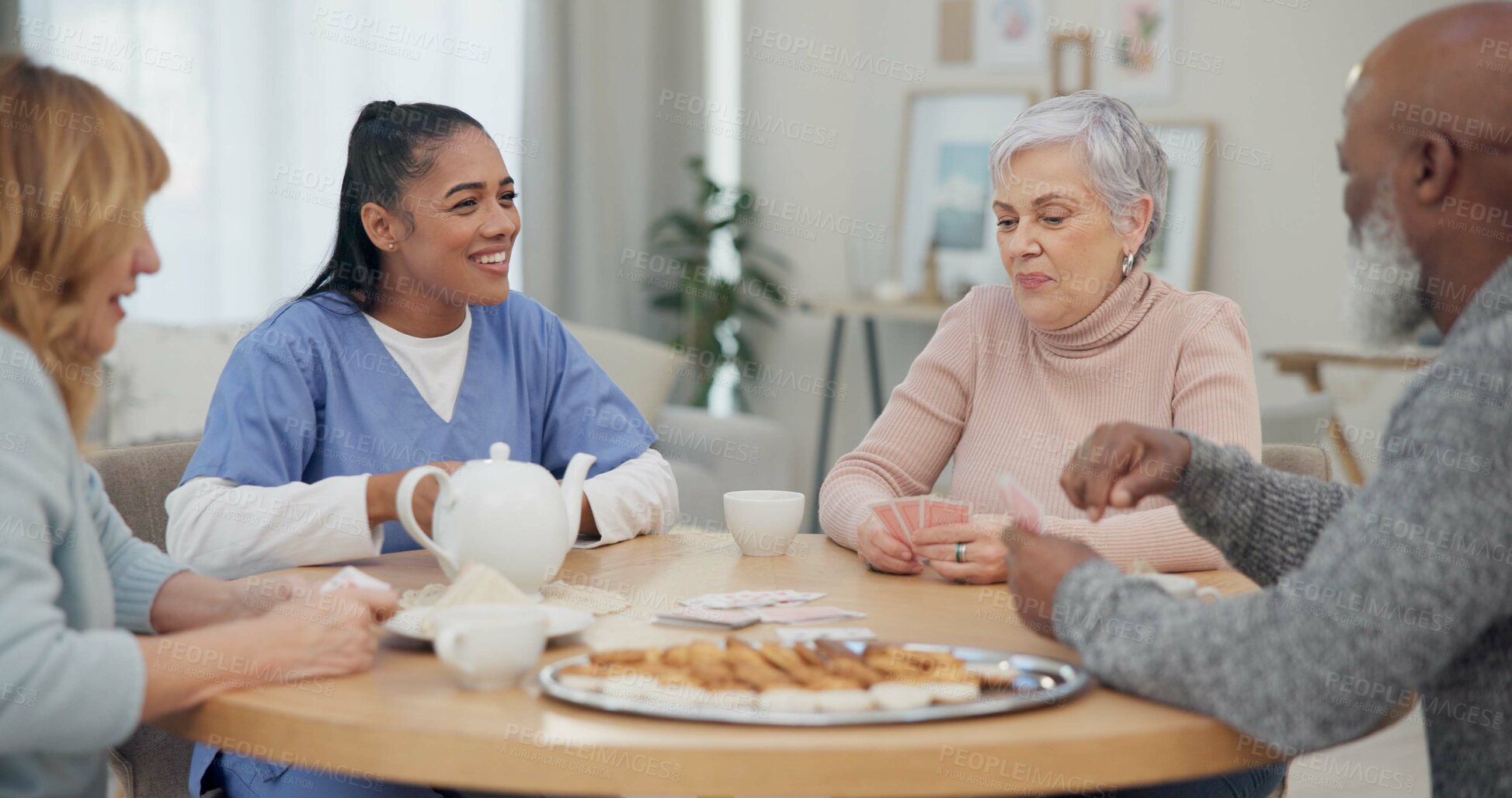 Buy stock photo Tea, happy and retirement with friends and playing cards in living room for relax, diversity and poker. Games, smile and community with group of old people in nursing home for party and celebration