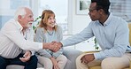 Senior, couple and handshake for life insurance planning and investment at a meeting. Finance, shaking hands and agreement deal for accounting and retirement budget for income savings with thank you