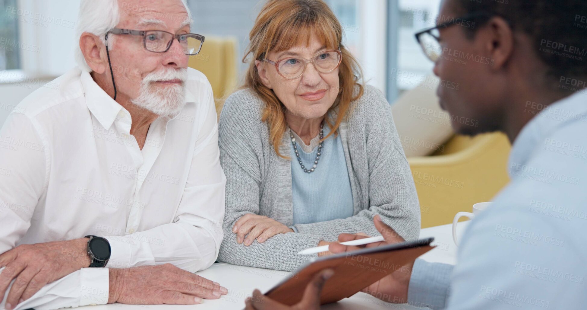 Buy stock photo Senior couple with a male financial advisor by a table in the dining room of their modern house. Conversation, meeting and elderly man and woman planning their retirement fund with accountant at home