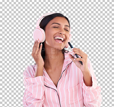 Singing, music and a woman with headphones before bedtime isolated on a blue background in a studio. Happy, playful and a girl listening to the radio, audio or streaming songs in pyjamas on a mobile