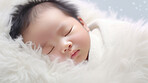 Closeup of sleeping newborn boy baby. Portrait of baby wrapped in blanket