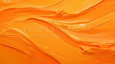 Orange smooth paint texture close-up. Swirl abstract background.