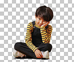 One asian boy looking sad and depressed while sitting on the floor and posing against orange copyspace background. Cute mixed race child with ADD looking bored and depressed