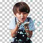 An adorable asian little boy having fun while blowing blue confetti at a gender reveal party.  Cute mixed race child being curious and playful in a studio