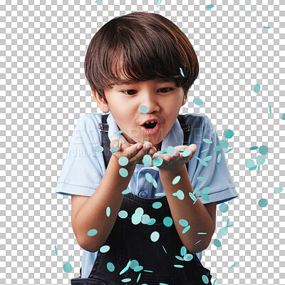 An adorable asian little boy having fun while blowing blue confetti at a gender reveal party. Cute mixed race child being curious and playful in a studio