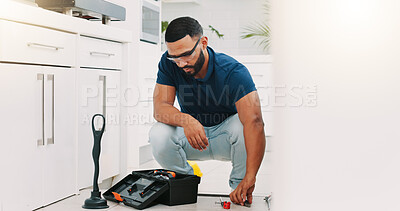 Plumber man, tools and box on floor maintenance with packing, focus and pipe repair service in house. Entrepreneur handyman, plumbing expert and small business owner with toolbox in home kitchen
