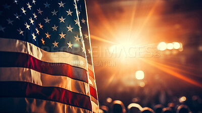 American flag at big political event, sign of patriotism.Big audience, copy space, sun flare.