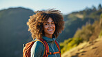 Happy african american woman hiking outdoors. Fitness hike and travel journey