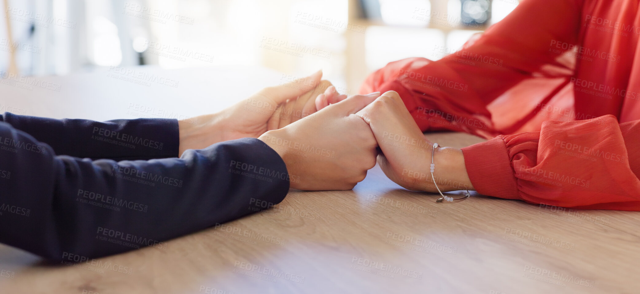 Buy stock photo Love, empathy and friends holding hands in comfort, support or solidarity during grief, loss or mourning. Depression, mental health and anxiety with two people praying together in trust for help