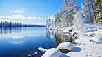 View of beautiful lake in winter. Forest, ground covered in snow.Travel concept