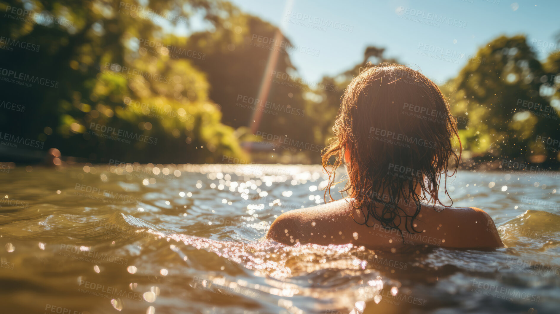 Buy stock photo Young women swimming in lake. Warm summers day. Sun flare reflecting on water.