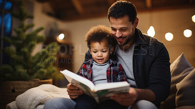 Young father reading a book to his son. Parent bonding and learning with toddler