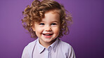 Portrait of a toddler posing against a purple background. happy smiling girl