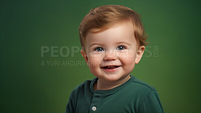 Buy stock photo Portrait of a toddler posing against a green background. happy smiling boy