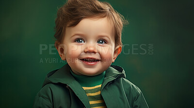 Buy stock photo Portrait of a toddler posing against a green background. happy smiling boy