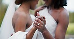 Wedding, lesbian and women dancing outdoor together at ceremony for celebration, happiness and romance. Marriage, love and lgbtq people holding hands and moving with smile in elegant dress in nature