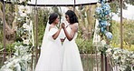 Women, wedding and lesbian dancing outdoor together at ceremony for celebration, happiness and romance. Marriage, love and lgbtq people holding hands and moving with smile in elegant dress in nature