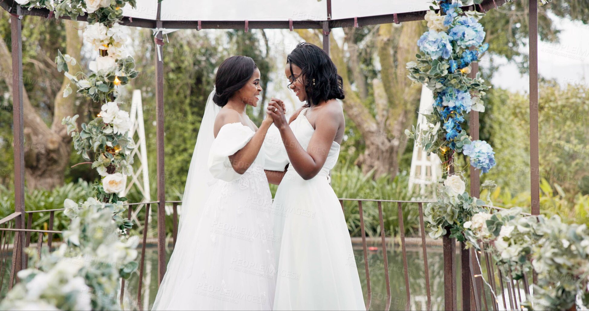 Buy stock photo Women, wedding and lesbian dancing outdoor together at ceremony for celebration, happiness and romance. Marriage, love and lgbtq people holding hands and moving with smile in elegant dress in nature