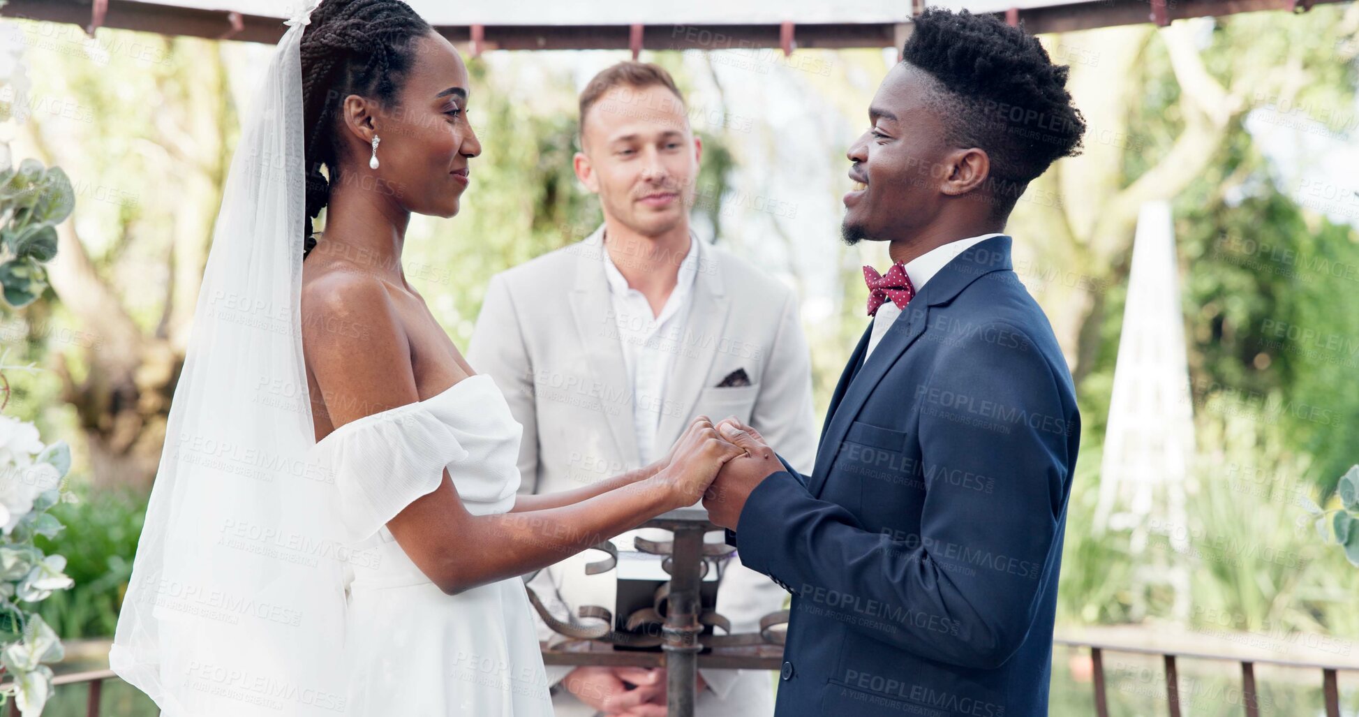 Buy stock photo Happy black couple, wedding and vows in marriage, commitment or support together at alter. Married African woman and man holding hands for love, trust or speech of bride or groom in outdoor romance