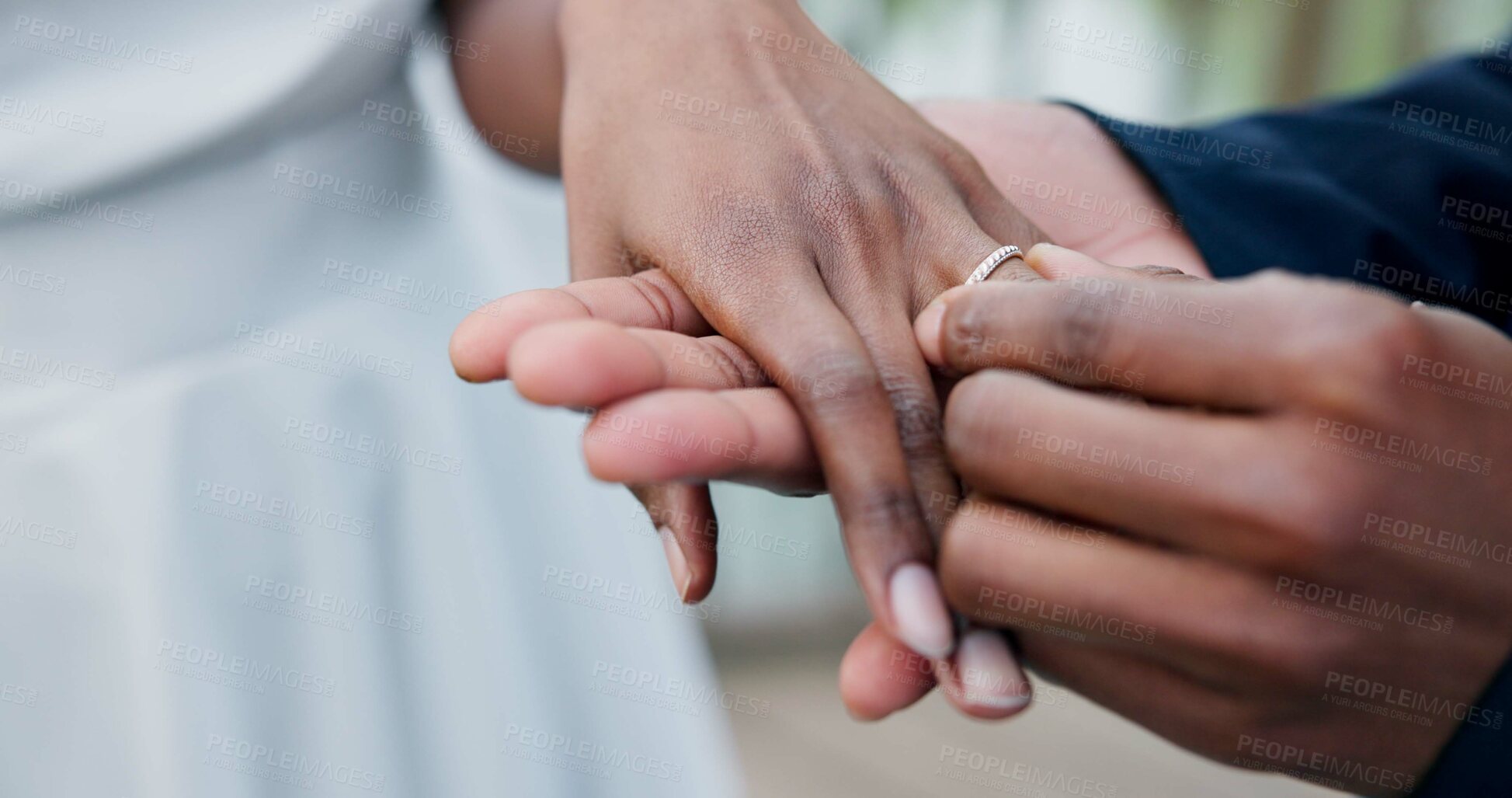 Buy stock photo Couple, holding hands and ring for marriage, love or wedding in ceremony, commitment or support. Closeup of people getting married, vows or accessory for symbol of bond, relationship or partnership