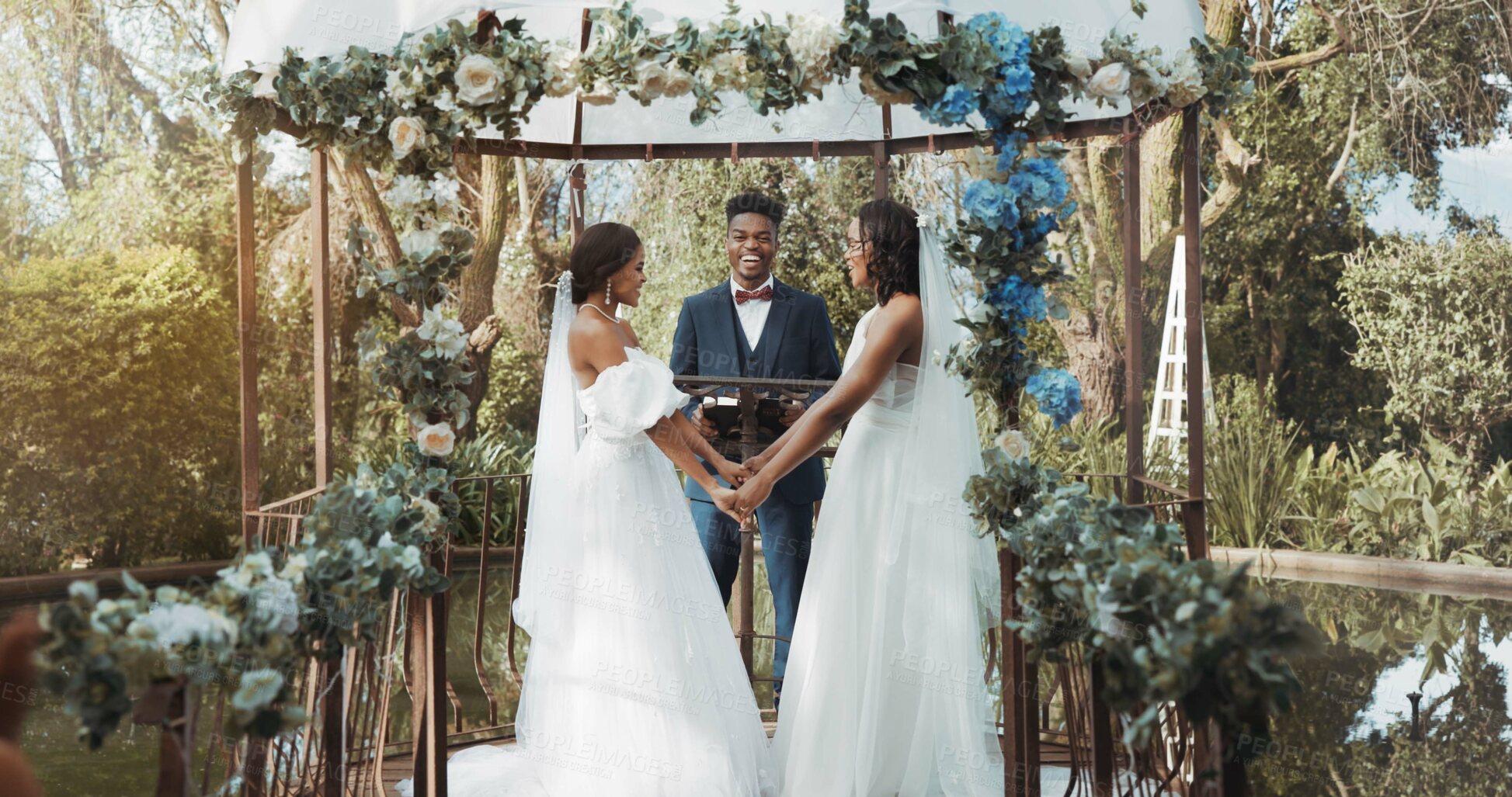 Buy stock photo Women, lesbian wedding and ceremony outdoor with priest for love, celebration or together for commitment. Gay marriage, event and party with bride, black man or vows in nature, lgbtq couple or garden