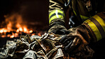 Firefighter hands taking money from pile with fire in background. Bribery payment concept