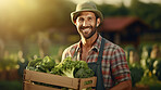 Farmer holding a box or crate with fresh organic vegetables or agricultural product