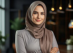 Portrait of muslim woman posing arms folded. Wearing hijab. Religion concept.