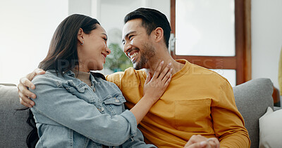 Buy stock photo Conversation, funny and couple on sofa in home living room, bonding and having fun. Smile, communication of man and woman in lounge for healthy connection of love, happy or laughing together in house
