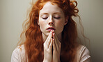 Beautiful young woman fold hands in prayer. Studio portrait. religion concept.