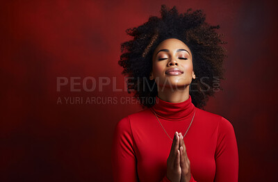 Buy stock photo African American woman praying. Studio portrait. Red backdrop. Religion concept.